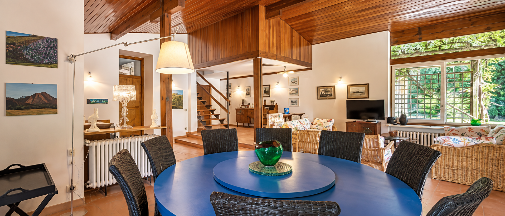 Restored Villa Passigli living room with timber ceiling and beams